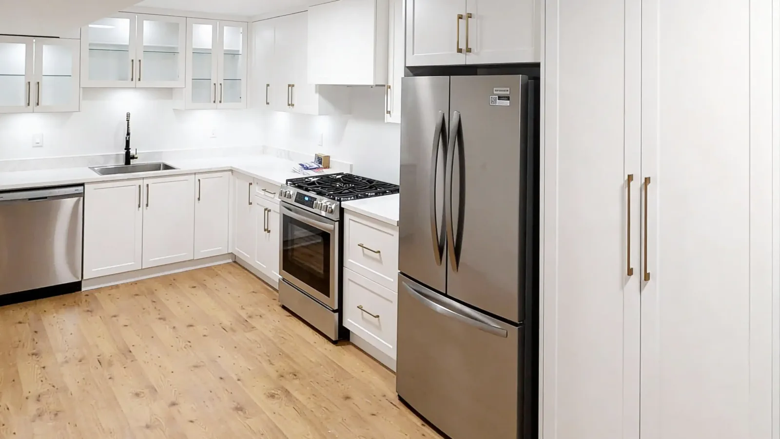 A modern kitchen inside a newly built legal basement secondary suite in Port Moody