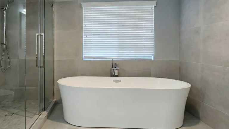 A fully remodelled bathroom in a Burnaby home with a tiled walk-in shower