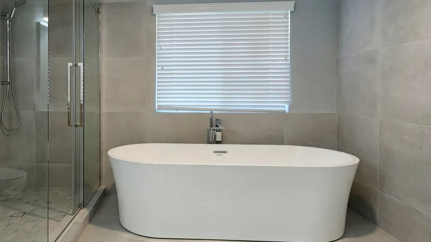 A fully remodelled bathroom in a Burnaby home with a tiled walk-in shower