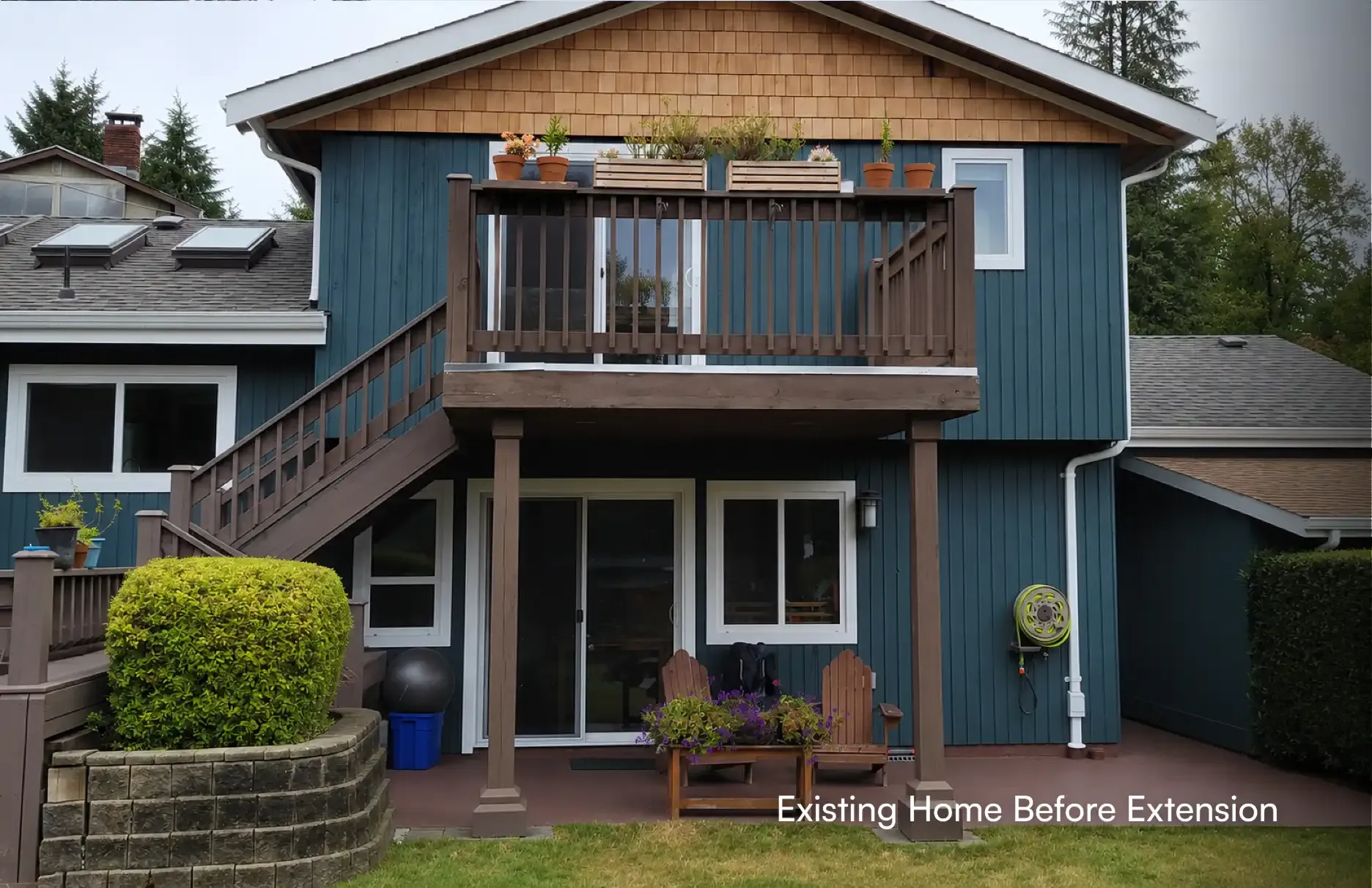 Full front exterior view of a house featuring a raised wooden balcony and patio area before starting a second-story home addition project by PCC Reno.