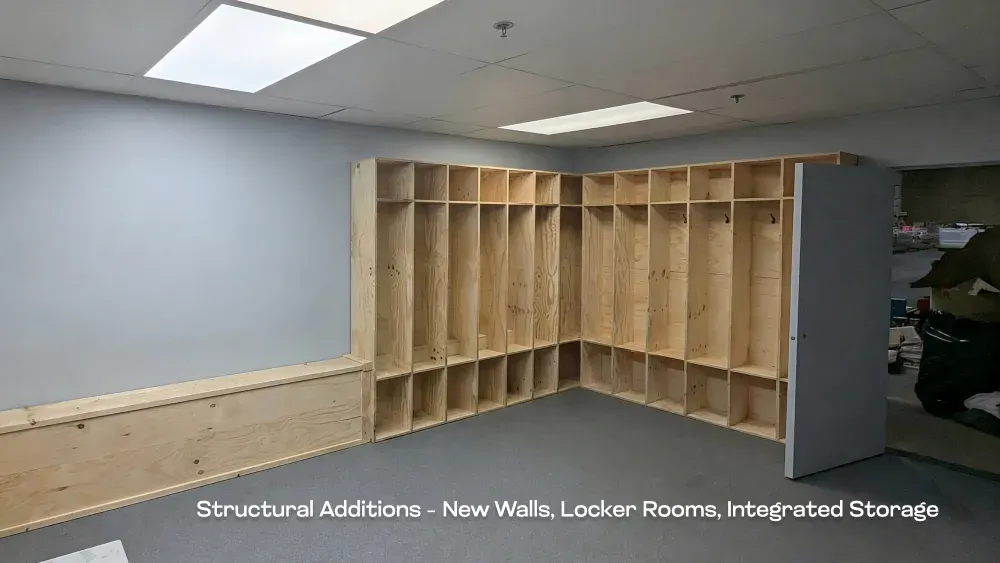 Structural additions in progress showing new framing for custom locker rooms and integrated storage by PCC Renovations.