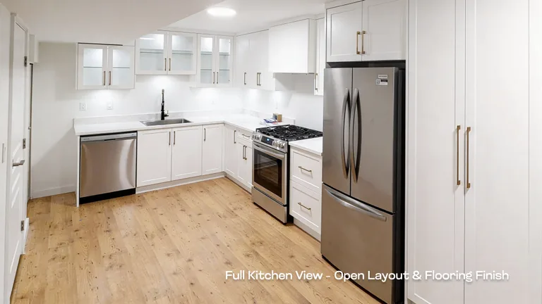 In-progress installation of soft-close drawer tracks and cabinet hardware inside a custom kitchen island.