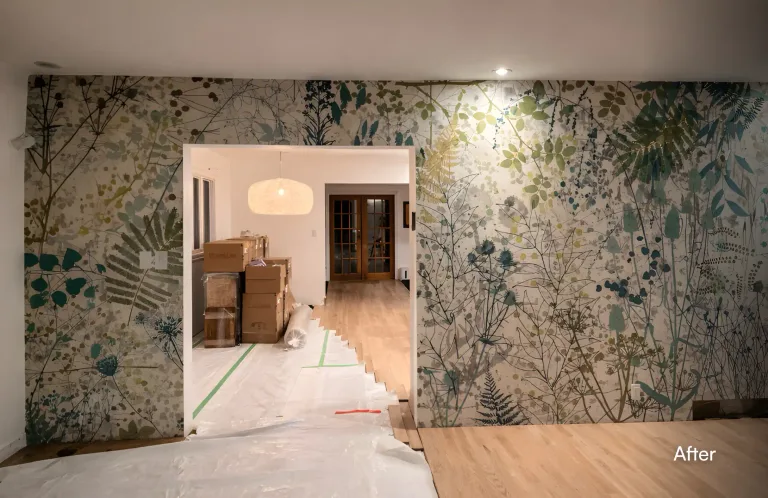A room showcasing a completed wallpaper installation with a dense, nature-inspired pattern of leaves and stems by Pacific Coast Contracting. — after